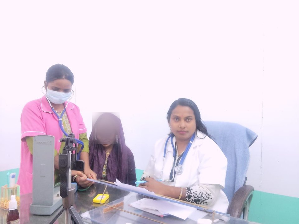 Doctor and nurse during an out-patient consultation at Shahnaz Hospital
